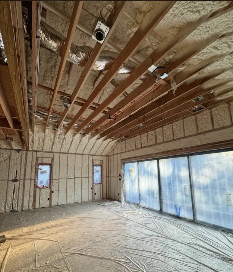 Interior walls and ceiling insulated with spray foam during new construction in Dunbar